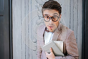 Close-up portrait of a funny nerd man wearing eyeglasses