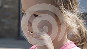 Close up portrait Girl enjoys delicious ice cream cone. Child eating watermelon popsicle. Kids Siblings snack sweets in