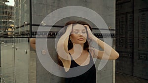 Close-up portrait of a girl on a wall background