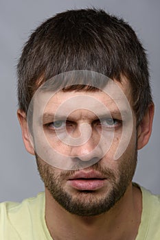 Close-up portrait of a gloomy man of European appearance