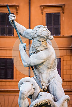 Close up portrait of God Neptune statue. Fountain of Neptune at the northern end of Navona Square /Piazza Navona/ in Rome, Italy.