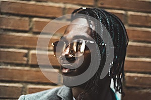 Close-up portrait of a handsome African-American man with outdoor sunglasses