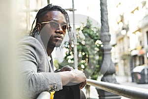 Close-up portrait of a handsome African-American man with outdoor sunglasses