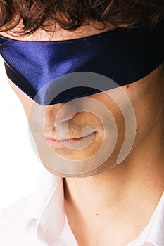 Close-up portrait of a handsome blindfold man