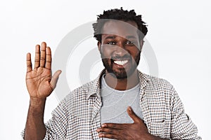 Close-up portrait handsome honest and friendly african-american bearded man, swearing or making statement, promise photo
