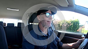 Close up portrait of handsome senior man driving a car