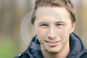 Close up portrait of handsome yound man outdoors