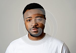 Close up portrait of handsome young man in neutral poker facial expressions and human emotions