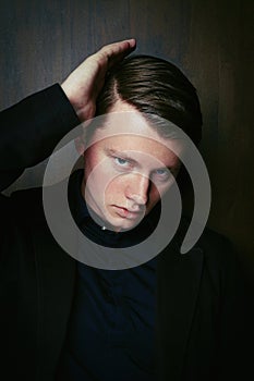 Close up portrait of handsome young man with trendy hairdo