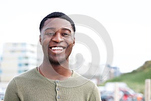 Close up of happy african american man smiling outdoors