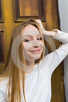 Close-up portrait of a happy blonde girl in casual clothes. Lifestyle concept