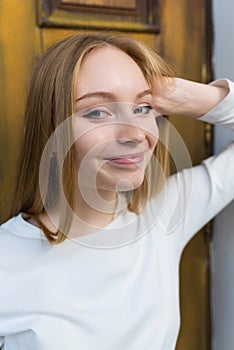 Close-up portrait of a happy blonde girl in casual clothes. Lifestyle concept