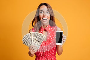 Close-up portrait of happy exited young brunette woman holding f