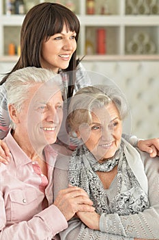 Close-up portrait of happy family posing at home