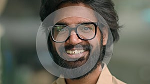 Close up portrait happy Indian bearded 30s businessman in eyeglasses male posing for camera. Handsome Arabian