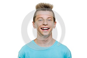 Close-up portrait of happy laughing teenager boy, smile with teeth, white background isolated