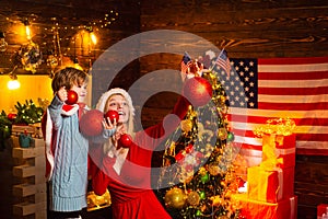 Close up portrait of happy mother and adorable baby celebrate Christmas. Christmas shopping concept. Concept of Merry