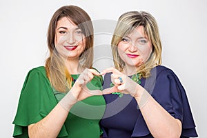 Close up portrait of happy mother and daughter