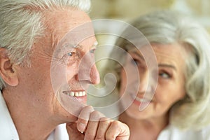 Close-up portrait of happy senior couple posing