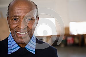 Close up portrait of happy senior man