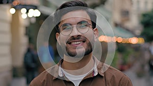 Close up portrait happy wide toothy smiling successful young handsome Indian Arabian Latino ethnic male student man guy