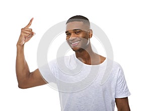 Close up portrait of a happy young man pointing finger