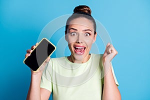 Close-up portrait of her she nice attractive charming gorgeous amazed cheerful cheery girl holding in hand device