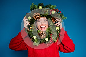 Close-up portrait of her she nice attractive cheerful cheery girl hold in hands looking through festal natural fir pine