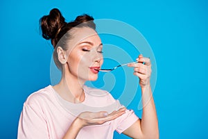 Close-up portrait of her she nice attractive cute dreamy brown-haired girl licking spoon enjoying healthy weight loss