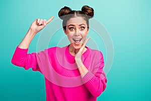 Close-up portrait of her she nice attractive lovely charming pretty amazed cheerful cheery girl demonstrating hair bun