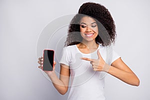 Close-up portrait of her she nice attractive lovely pretty glad cheerful cheery wavy-haired girl showing new product