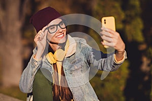 Close-up portrait of her she nice attractive pretty cheerful cheery girl blogger taking making selfie traveling social