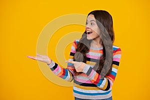 Close-up portrait of her she nice cute attractive cheerful amazed girl pointing aside on copy space isolated on yellow