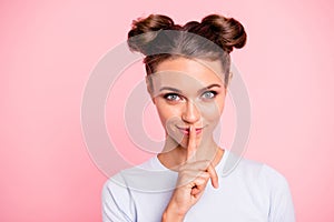 Close-up portrait of her she nice cute attractive cheerful girl lady showing shh sign isolated over pastel pink photo