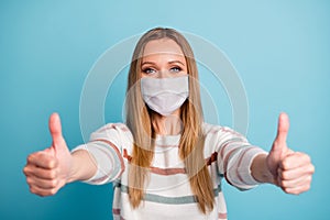 Close-up portrait of her she nice healthy girl wearing safety gauze mask giving two double thumbup mers cov influenza
