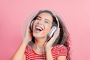 Close-up portrait of her she nice-looking attractive lovely charming cheerful cheery ecstatic wavy-haired girl meloman photo