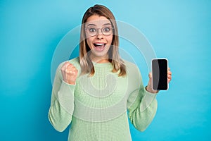 Close-up portrait of her she nice-looking attractive lovely glad cheerful cheery girl holding in hand cell celebrating