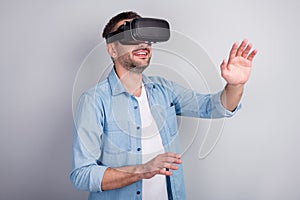 Close-up portrait of his he nice attractive cheerful dreamy guy wearing VR helmet headset playing game dream walking