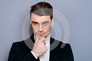 Close-up portrait of his he nice handsome attractive bearded candid guy wearing velveteen blazer touching chin thinking