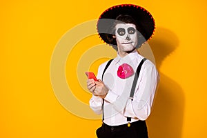 Close-up portrait of his he nice handsome cheery funny spooky guy caballero using device gadget app 5g blogg calavera photo
