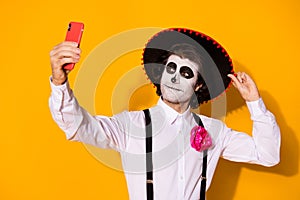 Close-up portrait of his he nice handsome painted creepy cheery guy caballero taking making selfie calavera celebratory photo