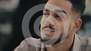 Close-up portrait Indian Hispanic ethnic bearded happy inspired guy smiling positive man worker entrepreneur businessman