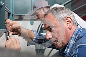 close up portrait laborers working on construction