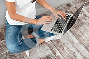 Close up portrait of a laptop computer on female lap