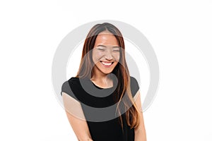 Close-up portrait of laughing attractive asian woman with closed