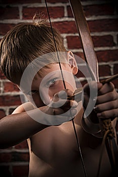 Close up portrait- little boy with bow and arrow