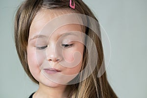 Close up portrait of little child girl with funny face expression