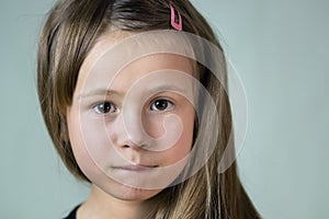 Close up portrait of little child girl with funny face expression