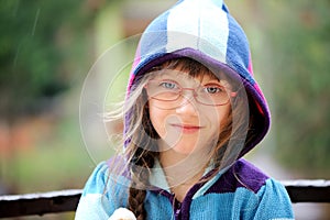 Close-up portrait of little girl in a hoody