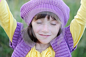 Close-up portrait of little girl in violet beret